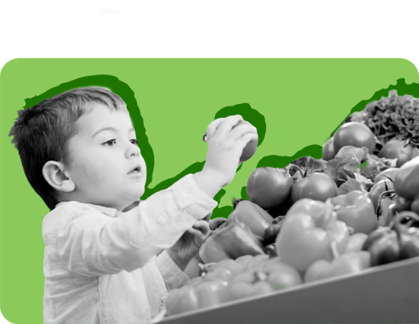 A toddler picks out fruit in a grocery store against a green background. WIC can help families afford healthy food.