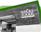 An image showing the exterior of a Whole Foods store against a green background