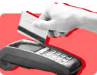 A hand slides a card through a card reader against a red background..