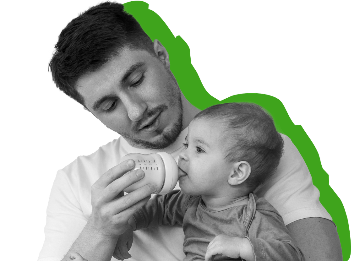 A dad feeding his baby a bottle		