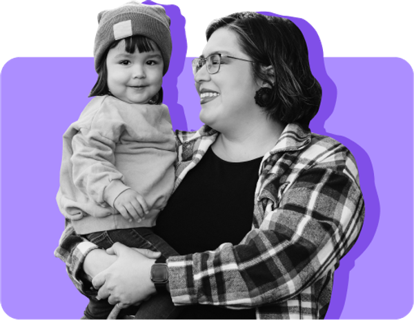 A woman holds her daughter on her hip against a purple background. Parents looking for free Halloween costumes this year have several options.
