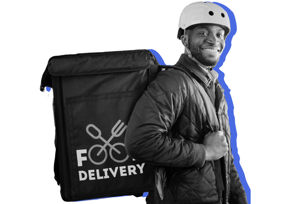 A delivery guy with an insulated bag and a bike helmet on stands in front of a blue background