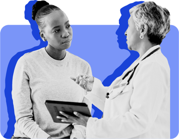An emergency room doctor shows a patient on Medicaid some information on a tablet against a blue background.
