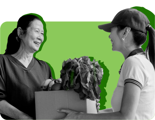 A recipient of SNAP, an entitlement program, picks up a bag of groceries from a store employee