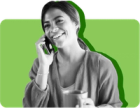 Woman on phone holding cup of coffee