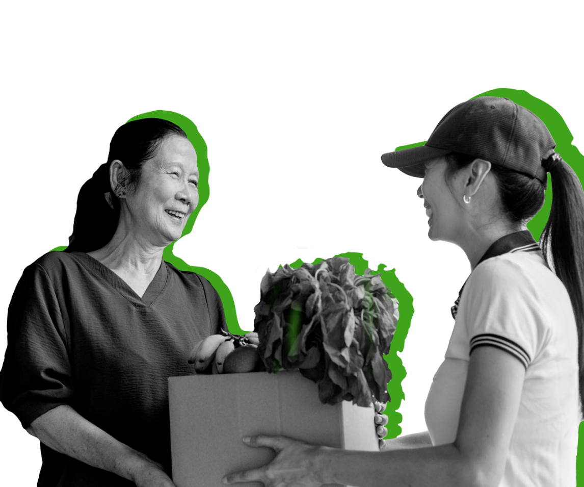A recipient of SNAP, an entitlement program, picks up a bag of groceries from a store employee