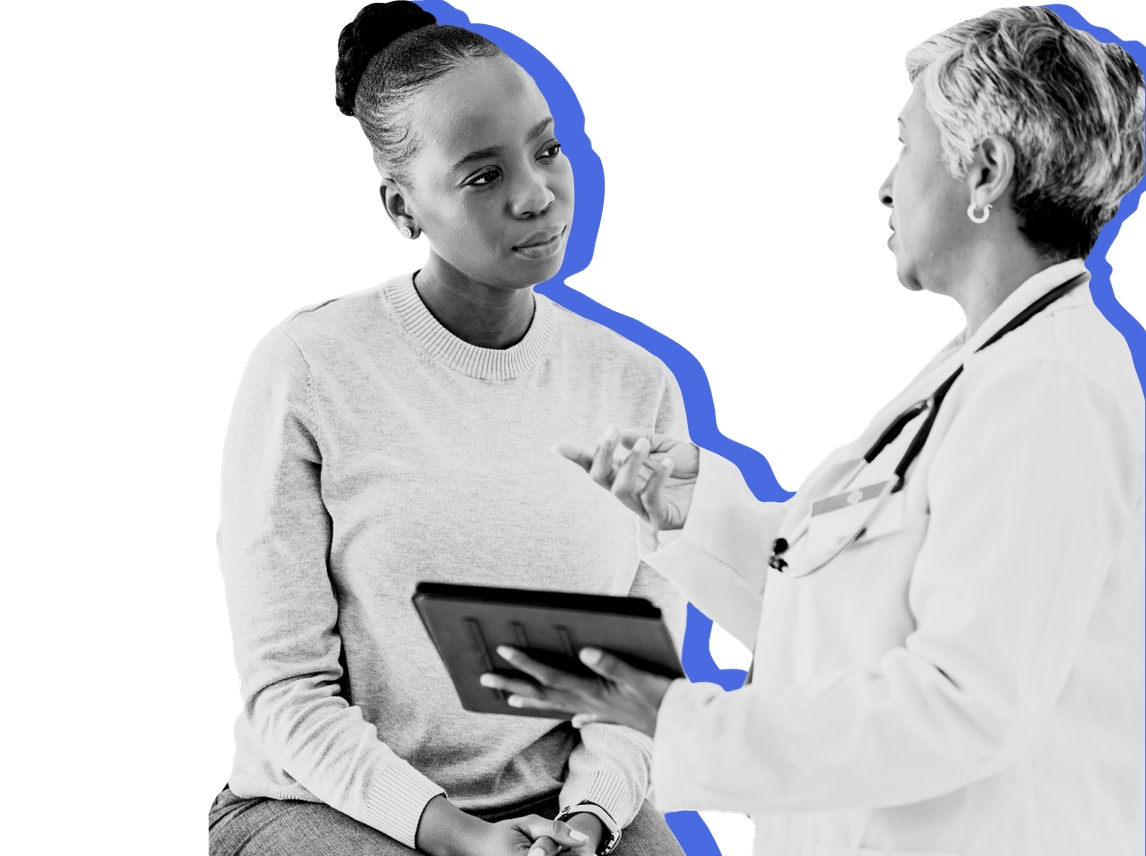 A doctor explains Medicaid changes to a patient against a blue background.