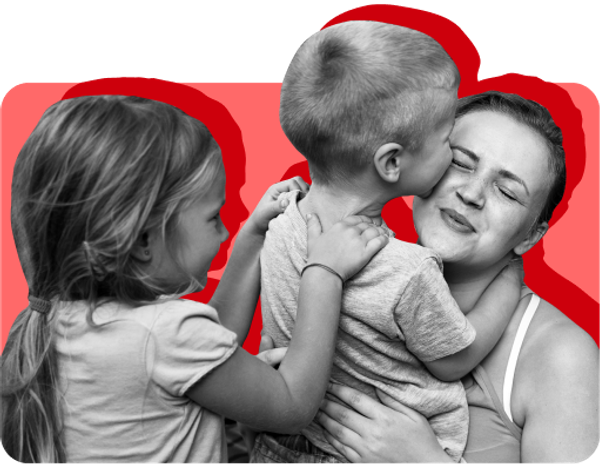 A low-income woman and children cuddle. Back-to-school season can be expensive for low-income families.