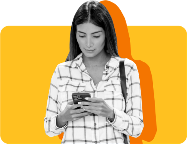A woman checks on her phone to see if energy drinks are SNAP-eligible against a yellow background