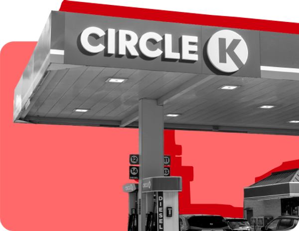 The exterior of a Circle K location pictured against a red background.