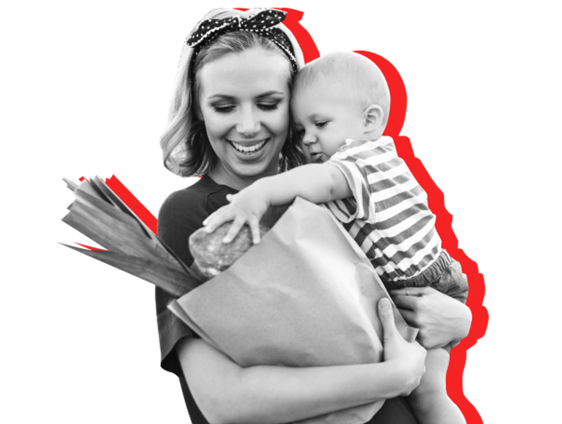 mom holding grocery bag and toddler