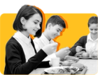 Students eat free and reduced-price school lunch against a yellow background