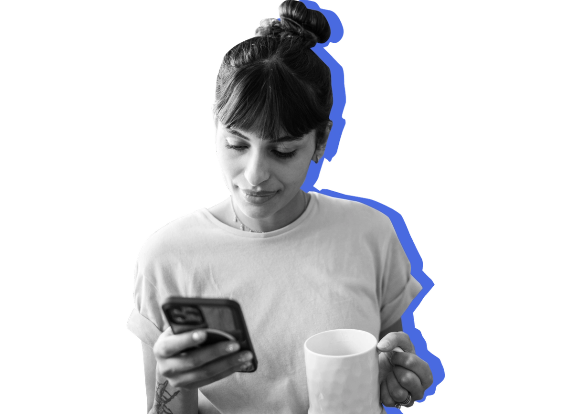 A woman checks her online SNAP portal on her phone while holding a mug against a blue background.