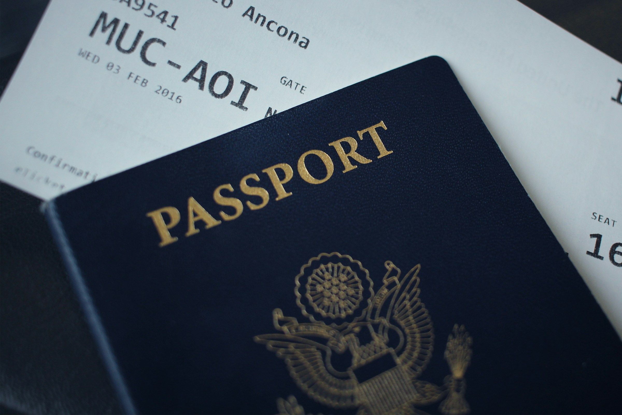 passport booklet on top of white paper