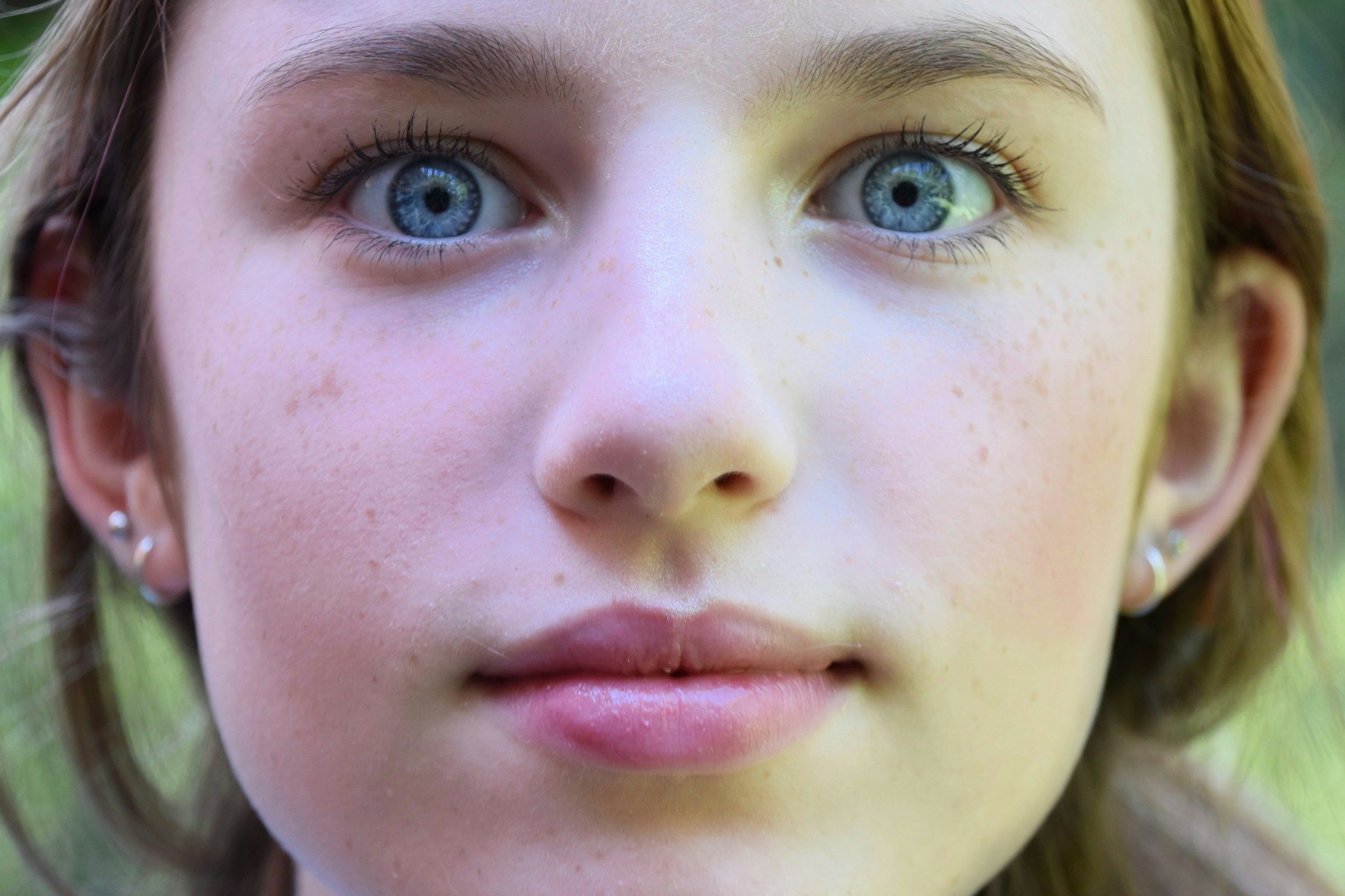 womans face with blue eyes