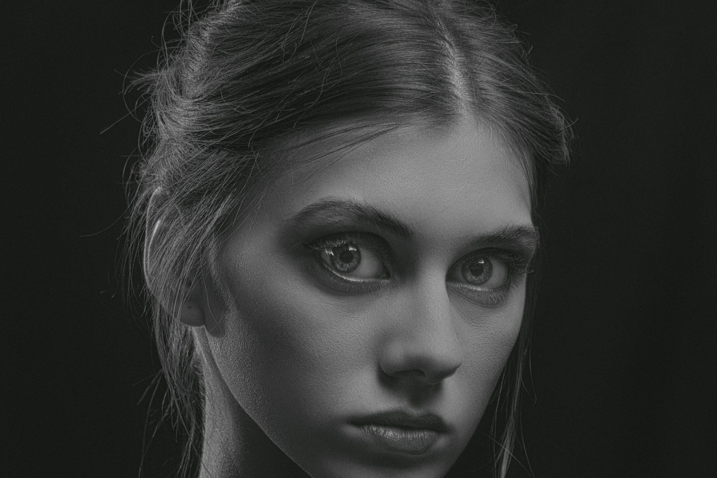 a black and white photo of a woman's face
