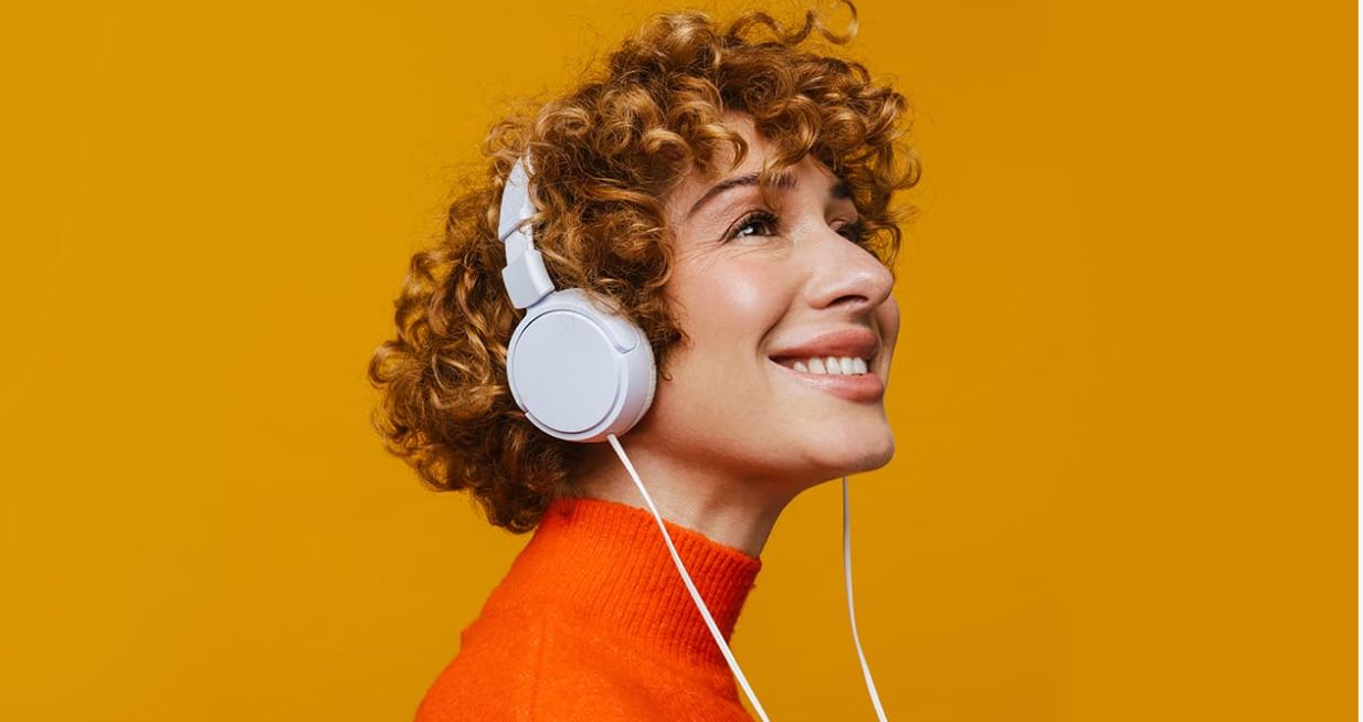 Girl with headphones listening