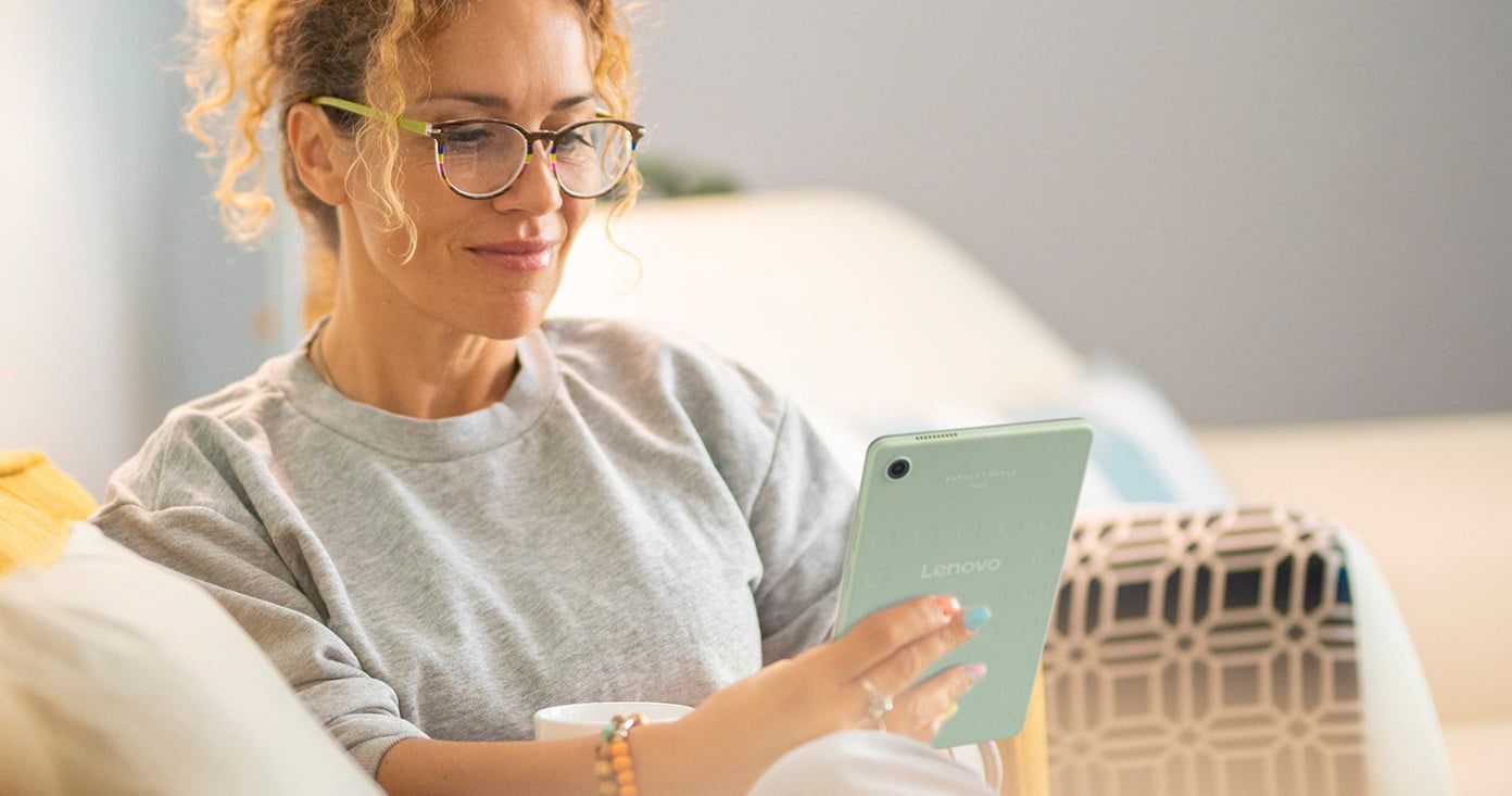 Woman Reading NOOK Reading Tablet in Seafoam Green