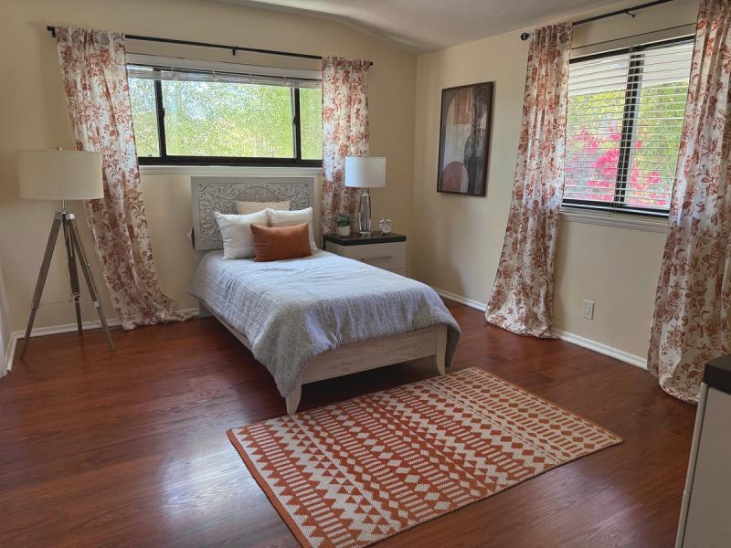 Resident bedroom with two windows