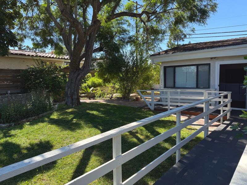 Garden walkway with plants and safety railing