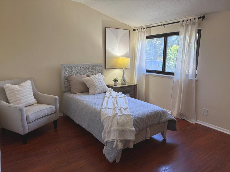 Resident bedroom with an armchair