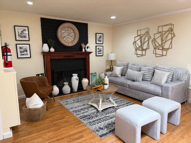 Second shared living area with a sofa and fireplace