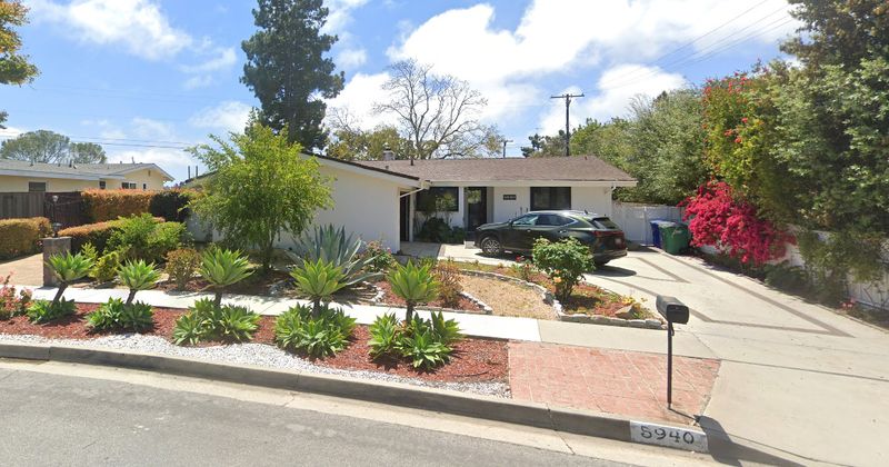 The front of Finecrest Villa at 5940 Finecrest Drive, with its landscaping and driveway