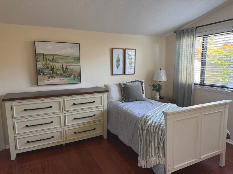 Resident bedroom with a dresser