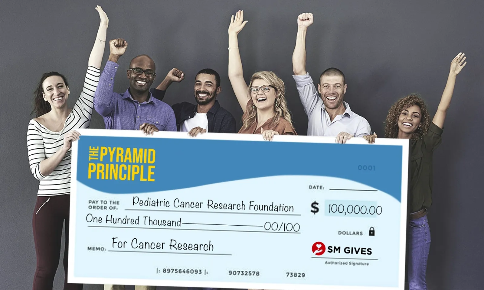 The Pyramid Principle presenting $100,000 check to Pediatric Cancer Research Foundation