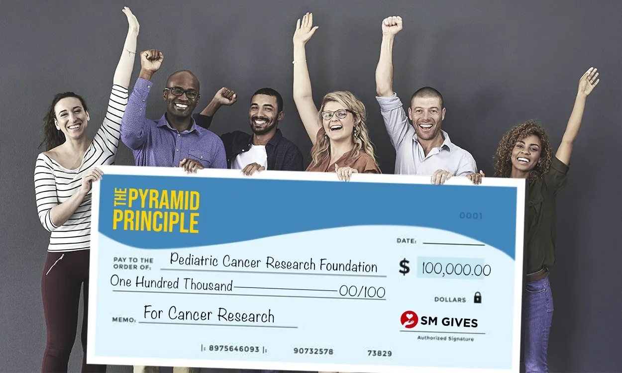 The Pyramid Principle presenting $100,000 check to Pediatric Cancer Research Foundation