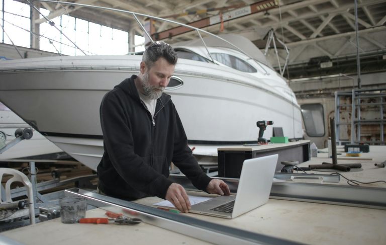 a calendar with seasonal boat maintenance tasks highlighted, emphasizing year-round care
