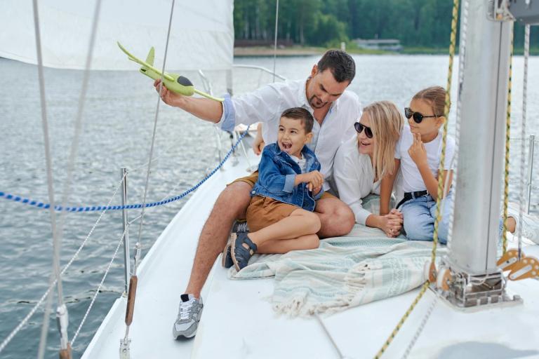 happy family enjoying a day on a boat together on the water