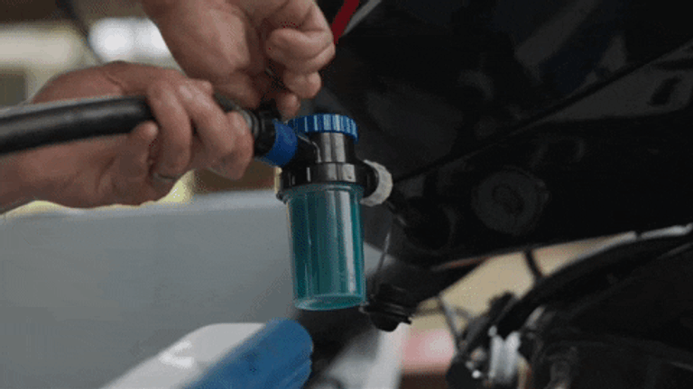 animated GIF demonstrating the cleaning process of a boat engine bay