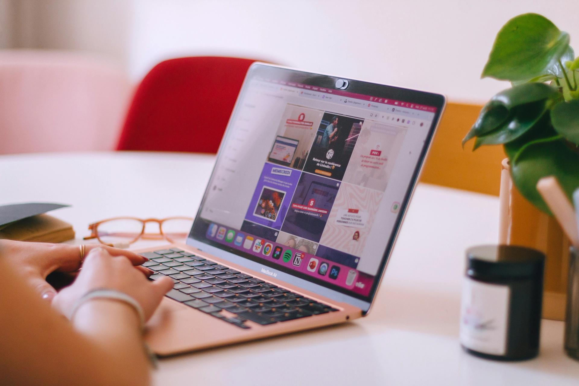 woman scrolling social media on laptop