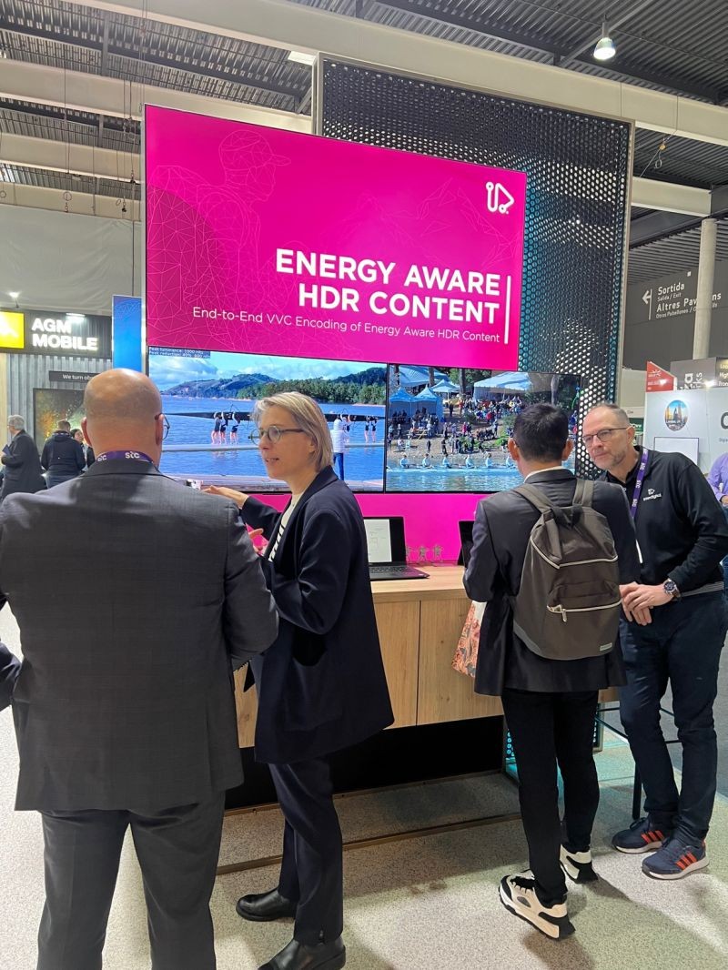 People gathered around a screen