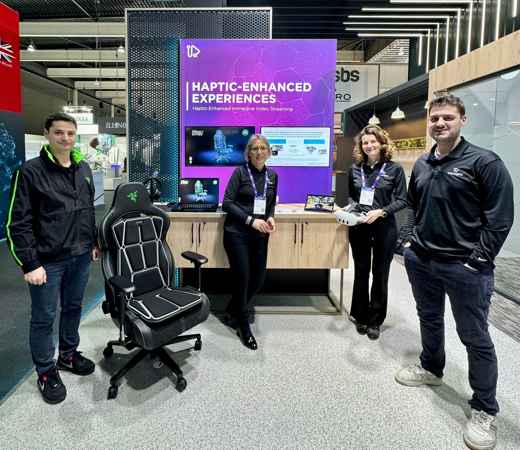 People standing in front of a screen