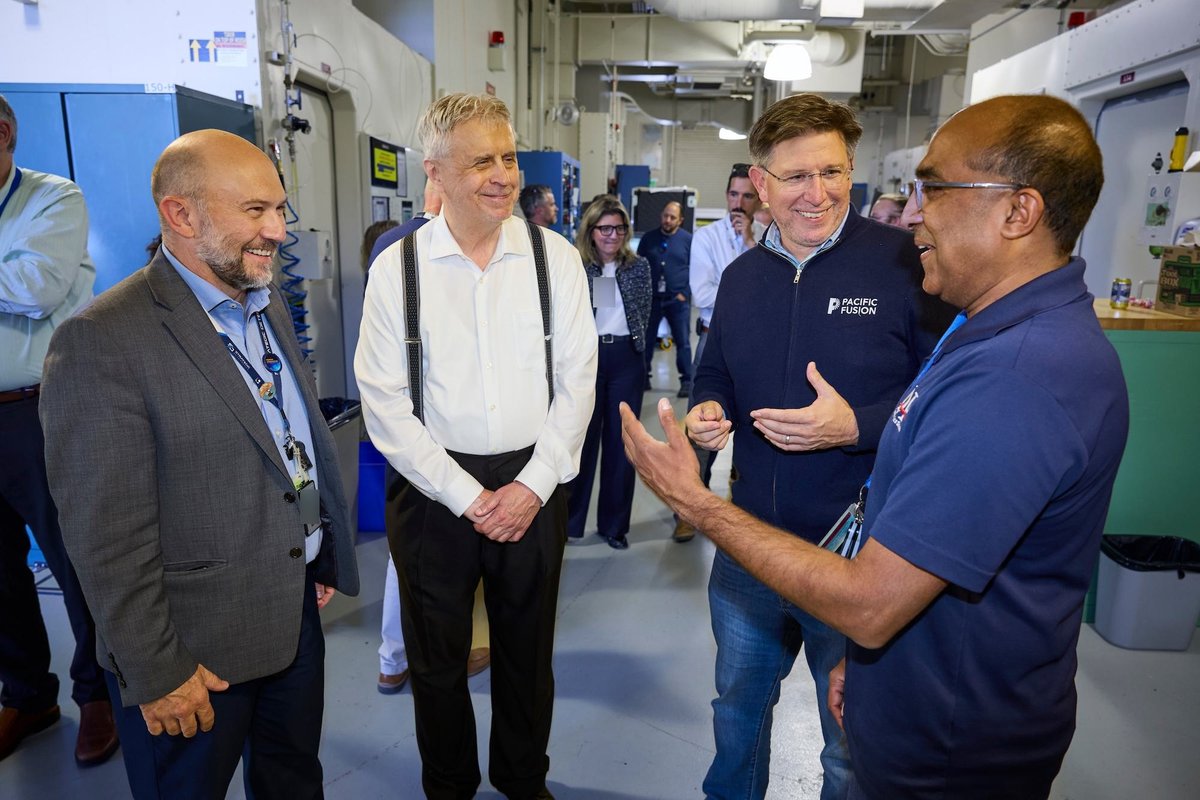 LLNL Deputy Director Brad Wallin, Bill Stygar, Keith LeChien, and Kumar Raman discuss the SIRIUS pulsed-power prototype during its 3,000-shot celebration. Photo: Garry McLeod, LLNL.