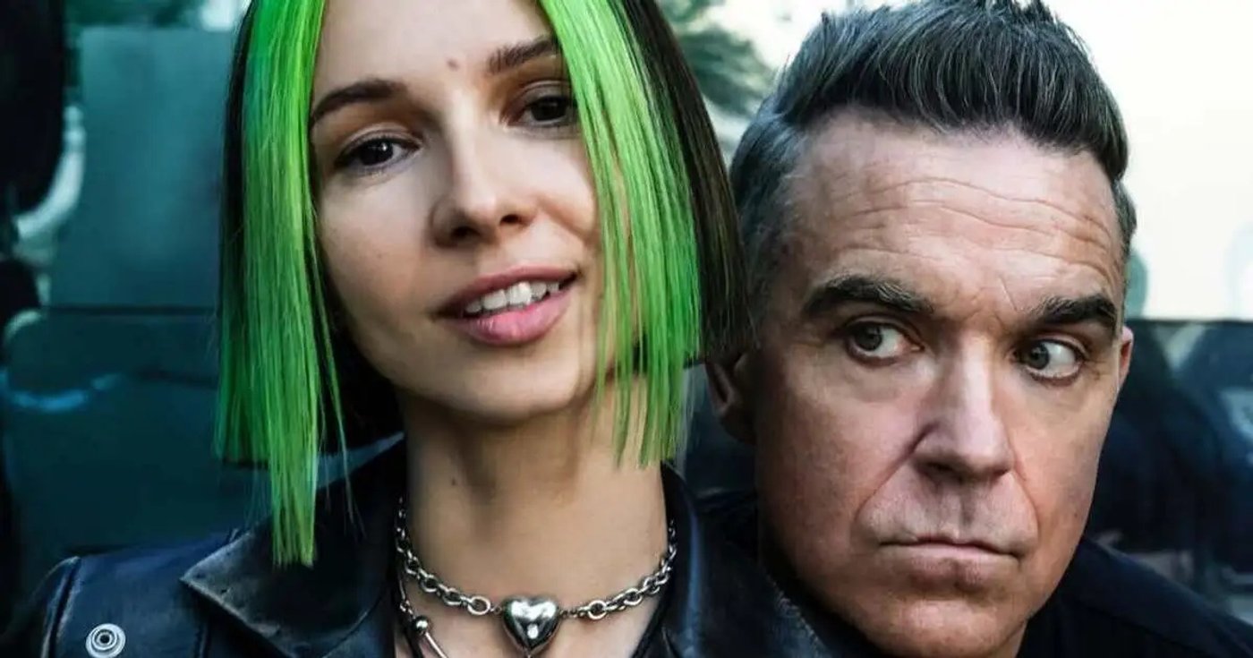 Miss Monique e Robbie Williams em fotografia juntos