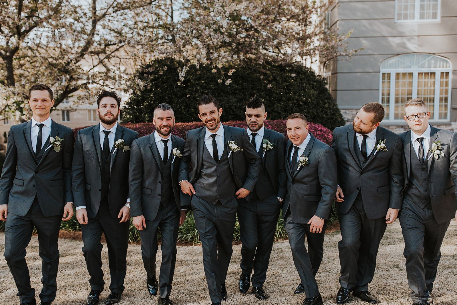 Groomsmen and guests in gray suits