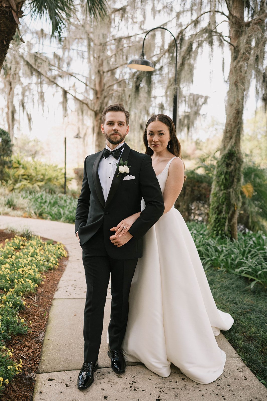 Bride and Groom in black tuxedo