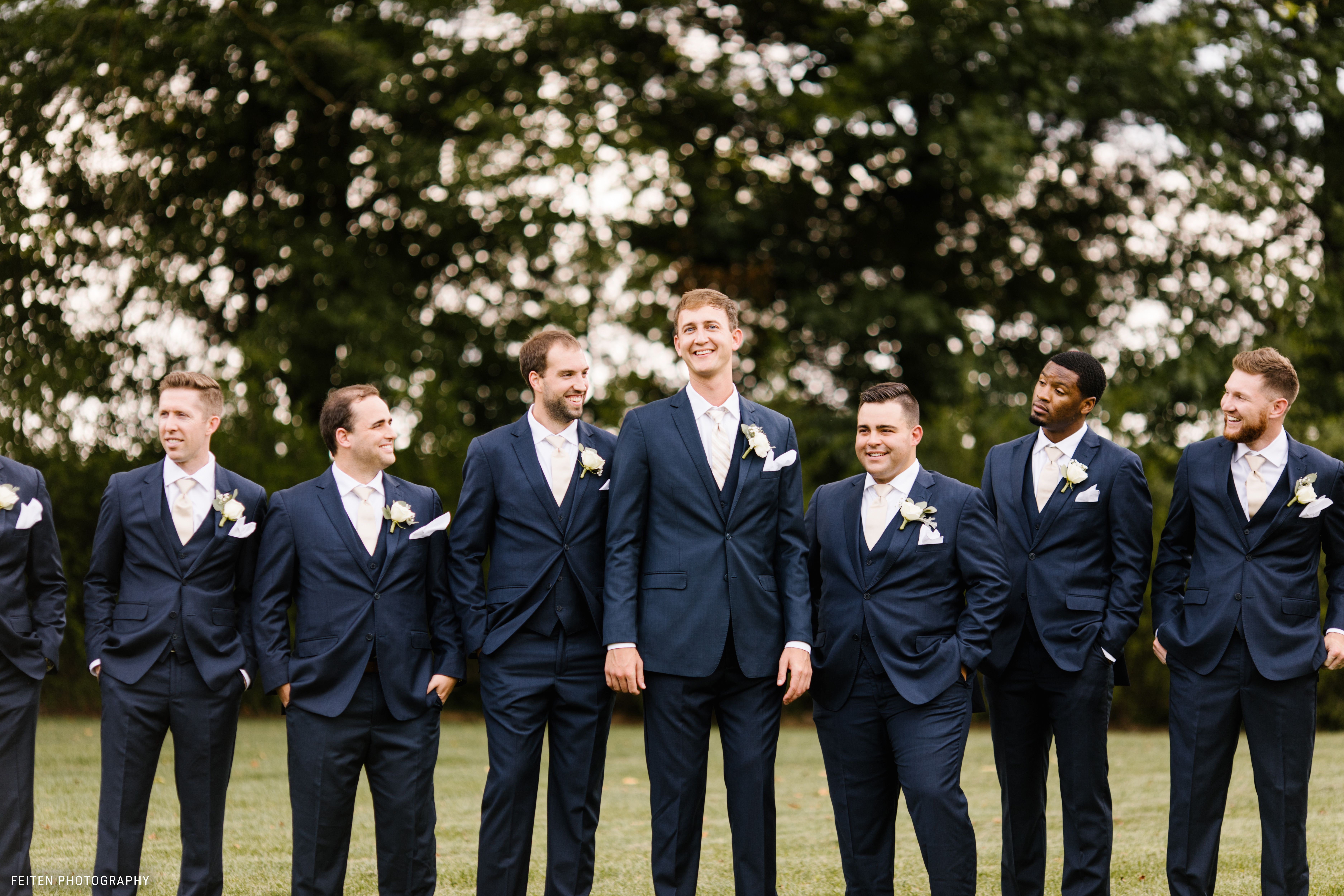 Groomsmen in navy blue suits