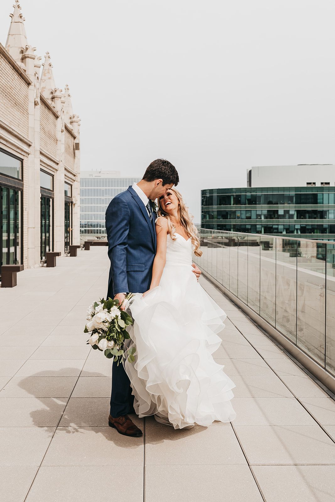 Bride and groom in blue suit 
