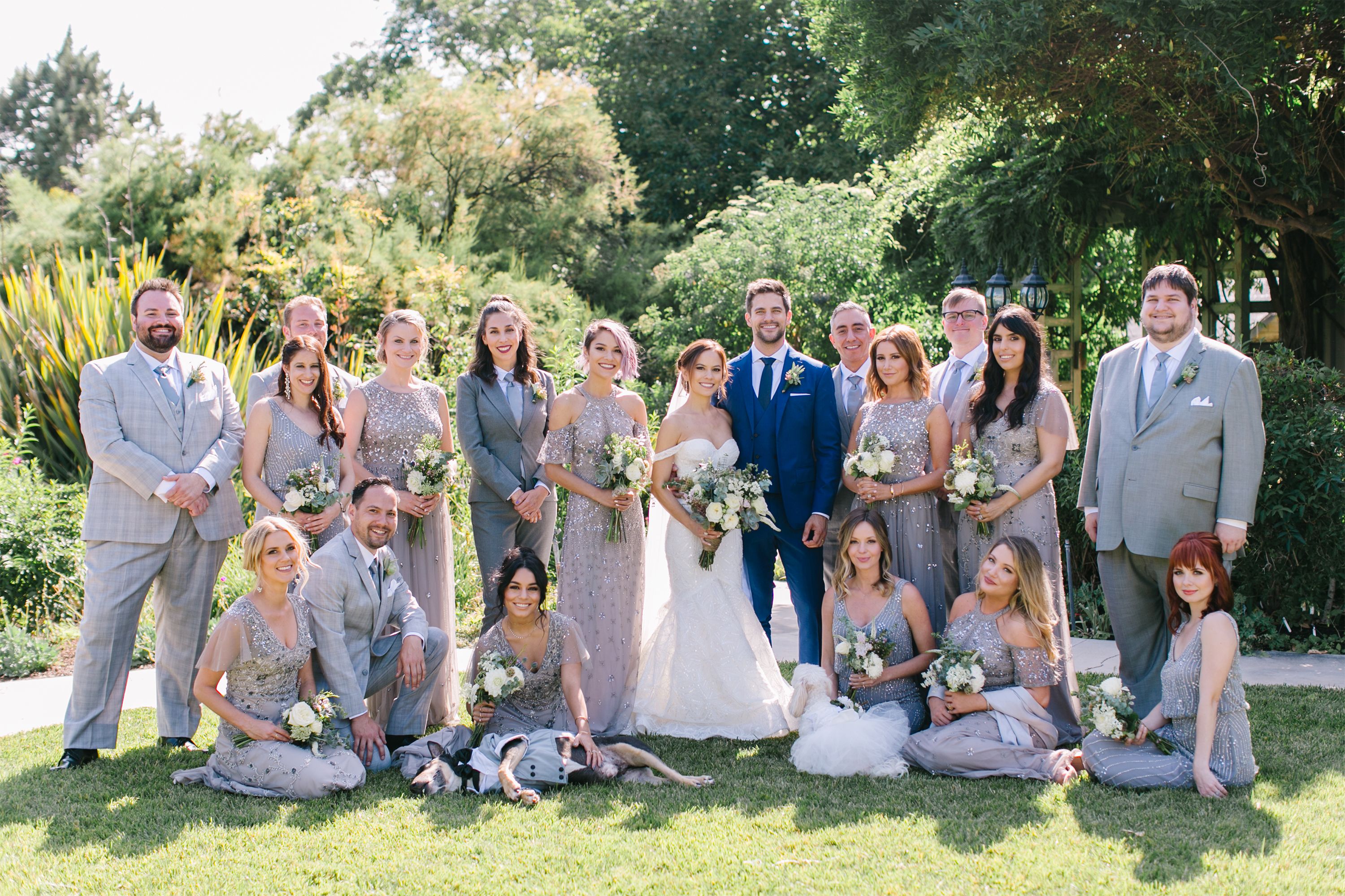 wedding photo of bridesmaids, groomsmen, and bride and groom in neutral grey colors