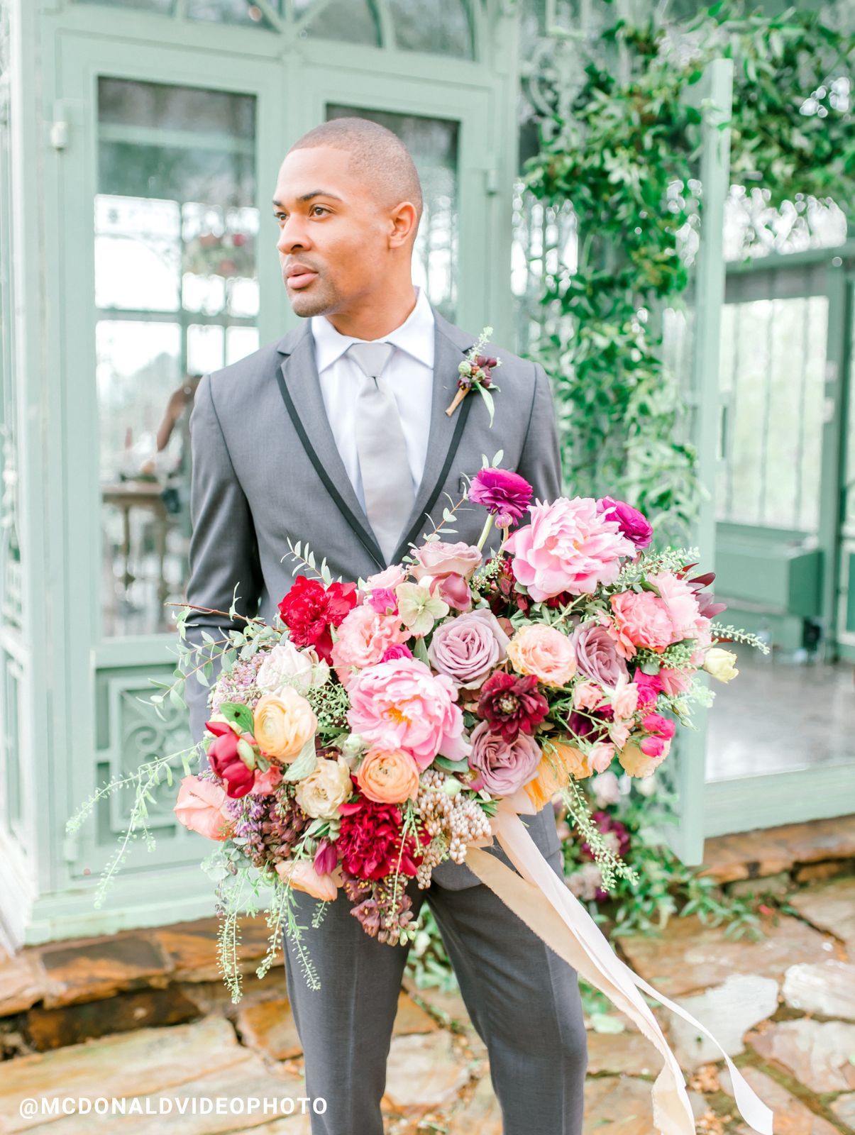 The groom in front of groomsmen