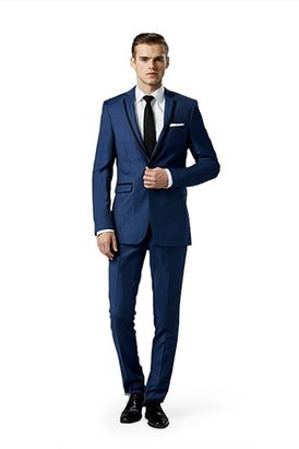 Mystic Blue Notch Lapel suit worn in front of a gray background.