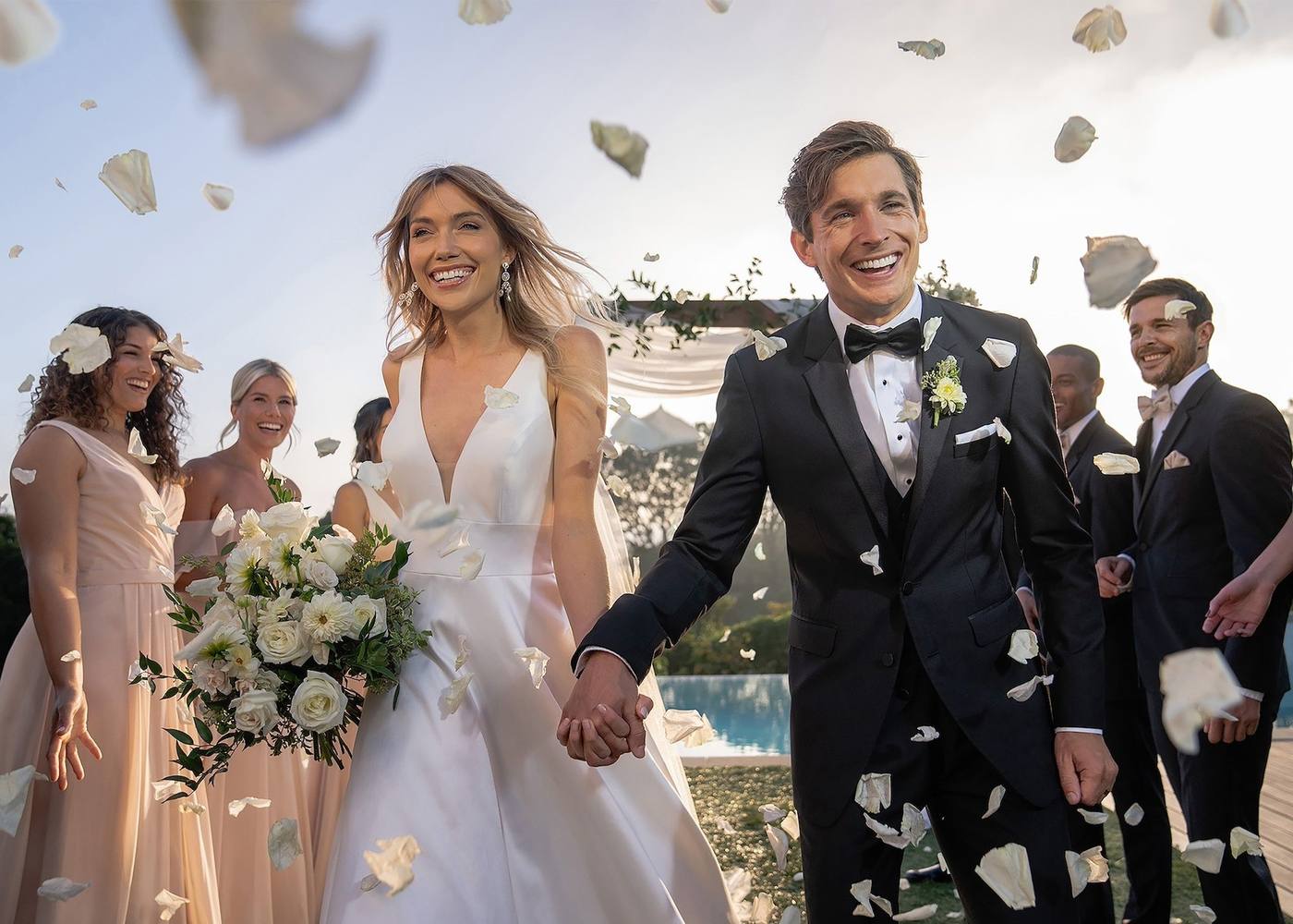A wedding couple with friends, the groom in a Generation Tux suit