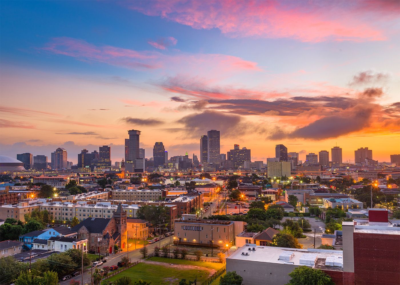New Orleans skyline with a sunset in the background