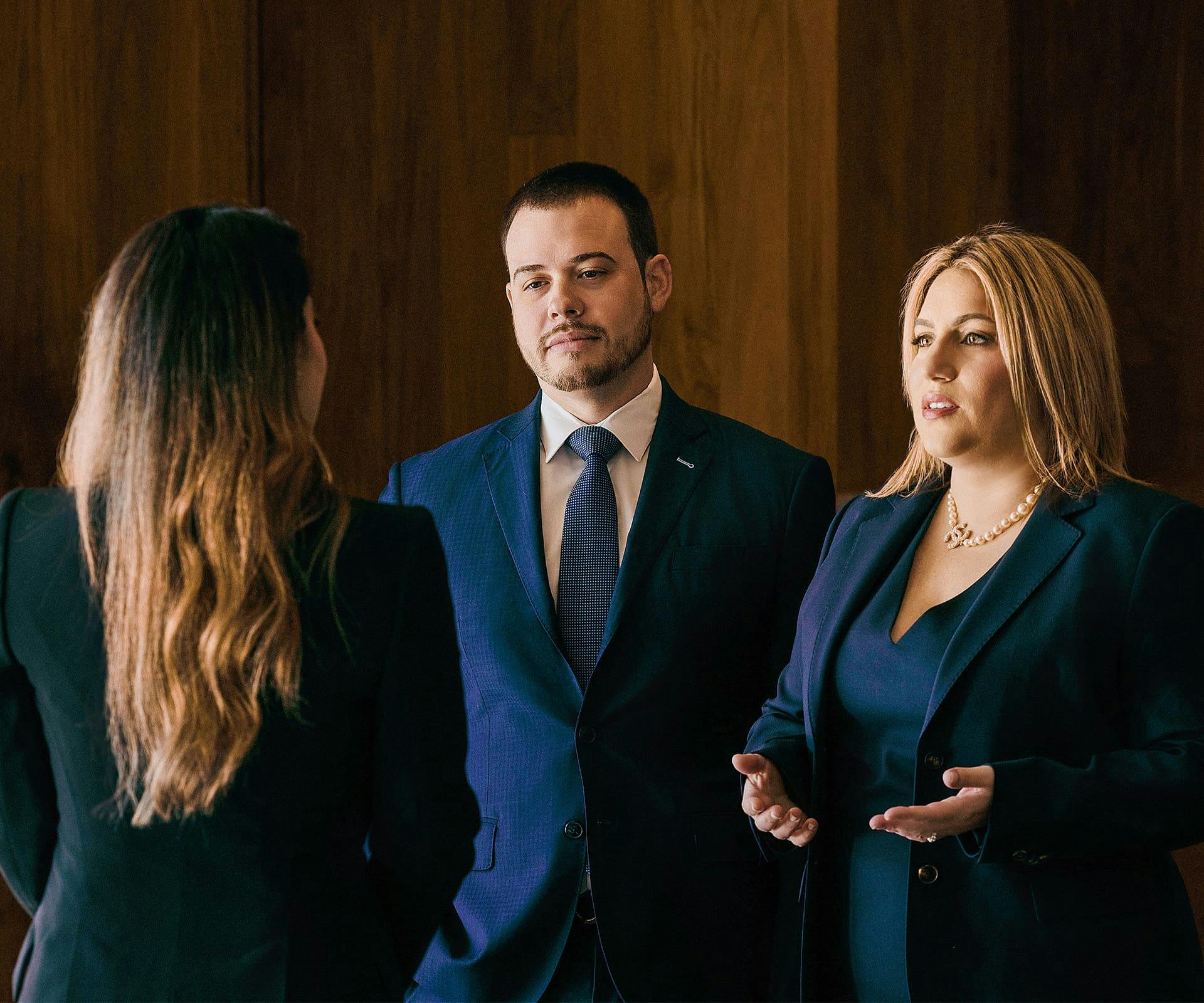 Lawyers and client speaking