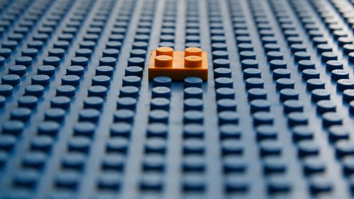 Orange block on a blue block base