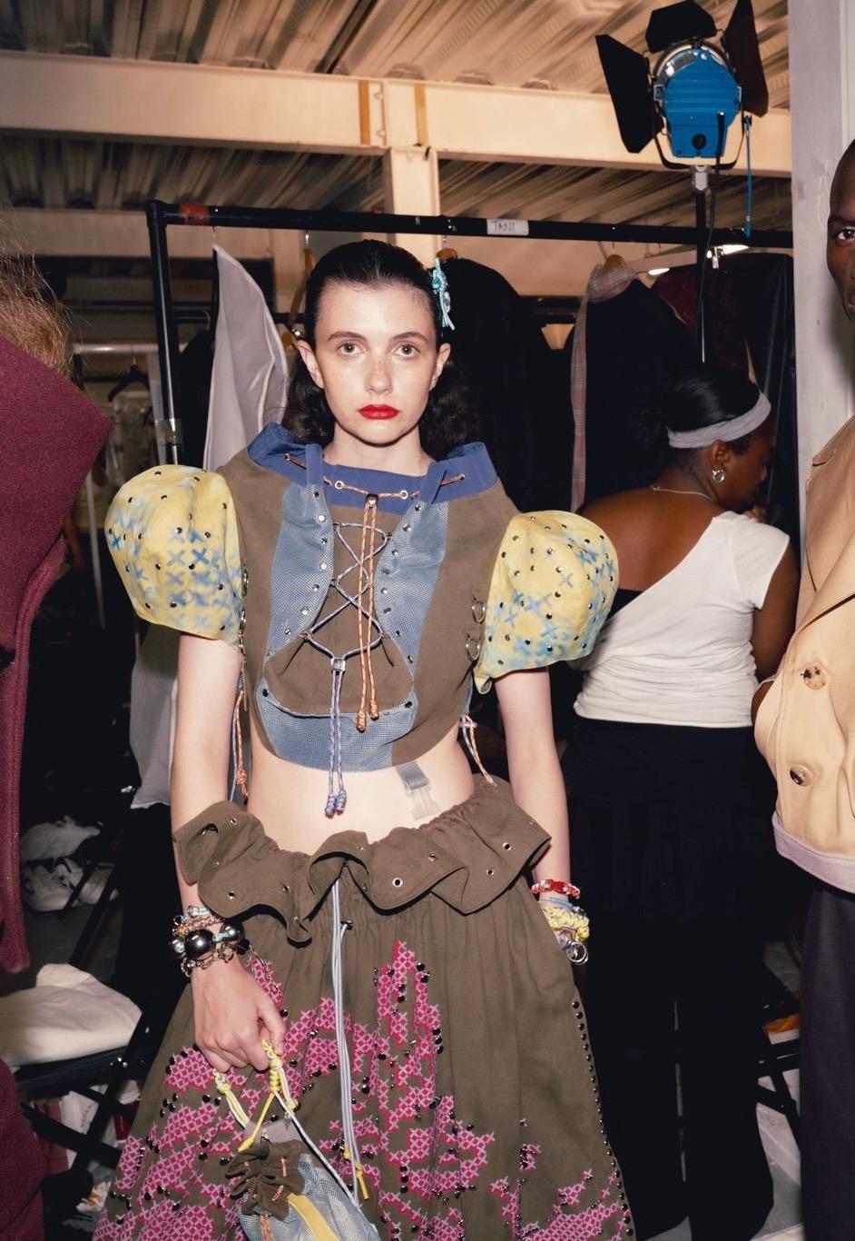 Backstage fashion week model backpack top